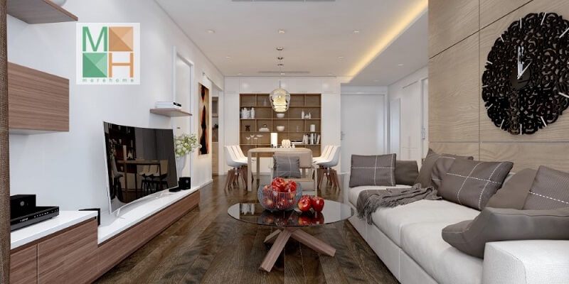 Thiết kế nội thất phòng khách chung cư nhỏ gọn với kệ ti vi treo tường kết hợp bộ sofa màu trắng với gối tựa màu ghi tạo điểm nhấn nổi bật cho căn phòng